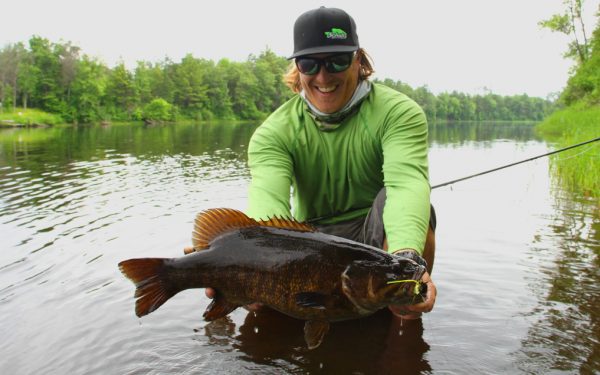 Smallmouth bass fly fishing in rivers.
